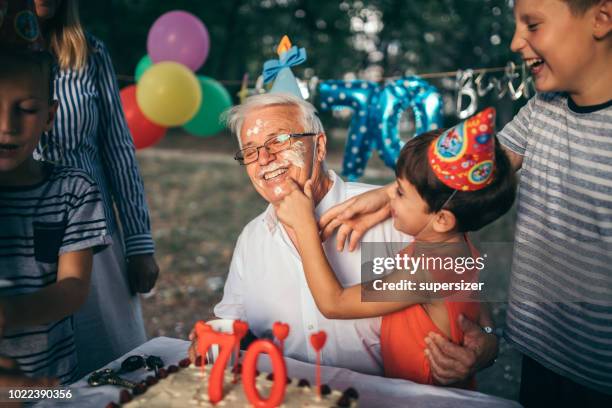 celebrating birthday with the family - food fight stock pictures, royalty-free photos & images