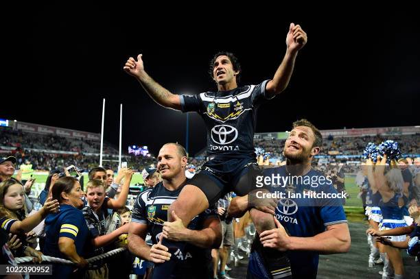 Johnathan Thurston of the Cowboys is chaired from the ground after playing his last home NRL match during the round 24 NRL match between the North...