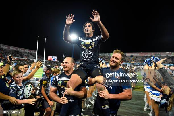 Johnathan Thurston of the Cowboys is chaired from the ground after playing his last home NRL match during the round 24 NRL match between the North...