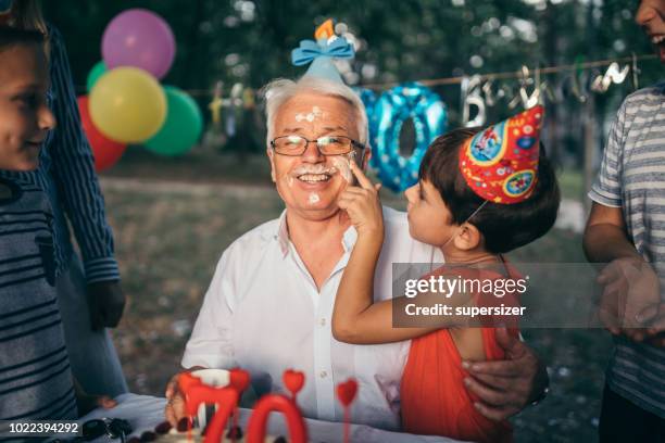 celebrating birthday with the family - food fight stock pictures, royalty-free photos & images