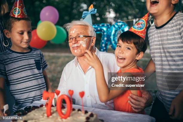 celebrating birthday with the family - food fight stock pictures, royalty-free photos & images