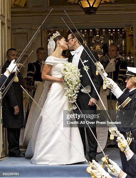 Crown Princess Victoria of Sweden, Duchess of Vastergotland and her husband Prince Daniel of Sweden, Duke of Vastergotland kiss as they leave...
