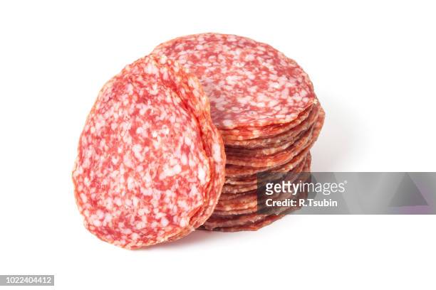 slices of salami isolated on a white background - salami stock pictures, royalty-free photos & images
