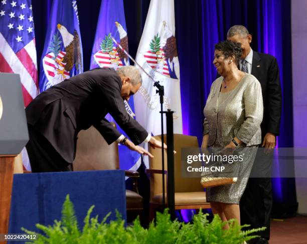 Attorney General Eric Holder 'bows' to American singer Aretha Franklin at the Robert F Kennedy Department of Justice Building, Washington DC,...