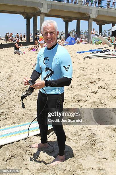 John Slattery gets ready to surf at the 3rd Annual Project SOS: SURF 24 - Day 1 at Southside Huntington Beach Pier on June 19, 2010 in Huntington...