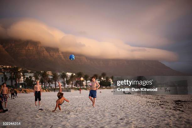 Children play football on the beach at Camps Bay on June 17, 2010 in Cape Town, South Africa.