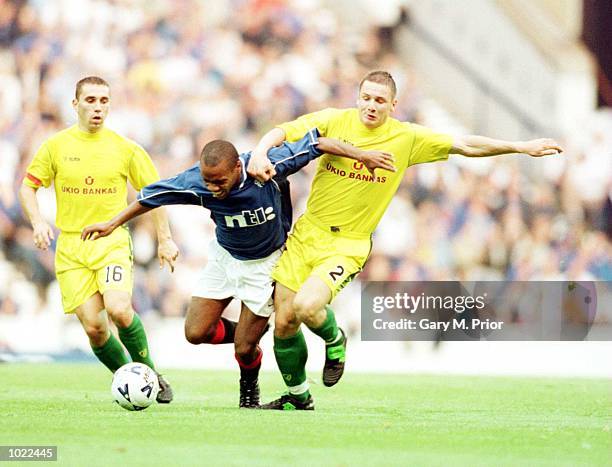 Rod Wallace of Glasgow Rangers clashes with Nerijus Barasa of FBK Kaunas during the UEFA Champions League Second Qualifying Round First Leg game...