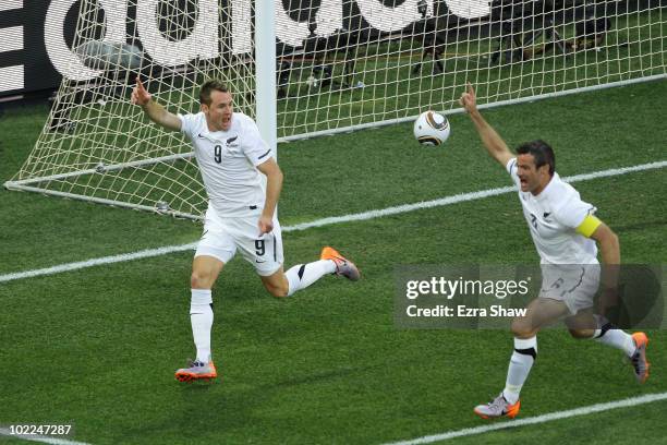 Shane Smeltz of New Zealand celebrates scoring the opening goal with captain Ryan Nelsen during the 2010 FIFA World Cup South Africa Group F match...