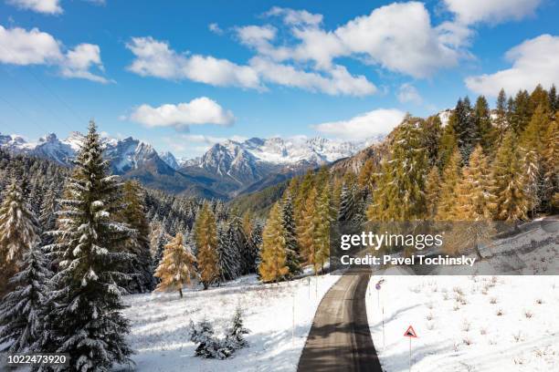 cibiana pass through italian dolomites after the first autumn snowfall, italy - veneto stock pictures, royalty-free photos & images
