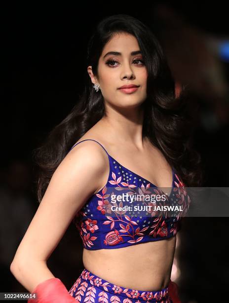 Indian Bollywood actress Jhanvi Kapoor showcases a creation by designer Nachiket at the Lakmé Fashion Week Winter Festive 2018 in Mumbai on August...