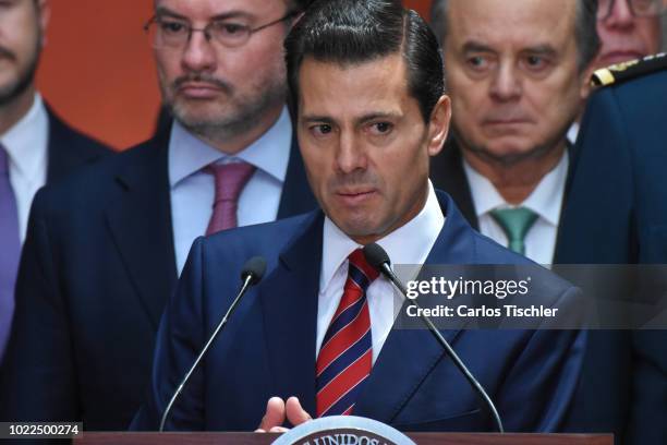 President of Mexico Enrique Peña Nieto speaks during a press conference at Palacio Nacional on August 20, 2018 in Mexico City, Mexico. Obrador met...