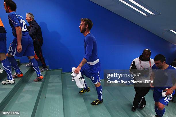 Daniele De Rossi of Italy and his team mates show their dejection as they walk up the stairs to the dressing room after the 2010 FIFA World Cup South...