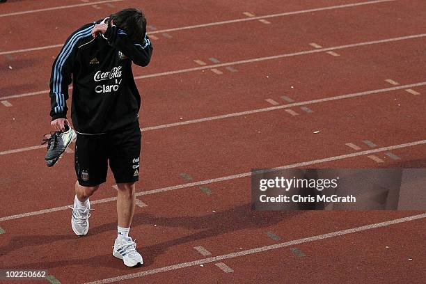 Lionel Messi of Argentina's national football team walks from the pitch during a team training session on June 20, 2010 in Pretoria, South Africa.