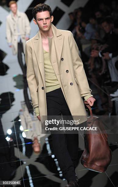 French model Tom Nicon presents a creation as part of Burberry Prorsum Spring-Summer 2010 Menswear collection on June 20, 2009 during the Men's...
