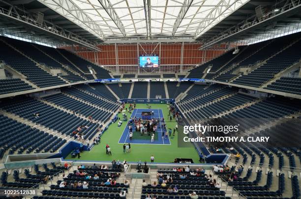 Andy Murray of Great Britain talks to the press during the US Open media availability on August 24 in the new Louis Armstrong Stadium at the USTA...