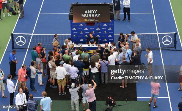 Andy Murray of Great Britain talks to the press during the US Open media availability on August 24 in the new Louis Armstrong Stadium at the USTA...