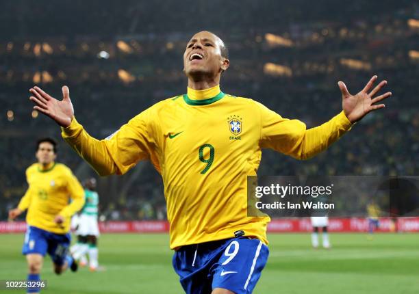 Luis Fabiano of Brazil celebrates scoring the opening goal during the 2010 FIFA World Cup South Africa Group G match between Brazil and Ivory Coast...