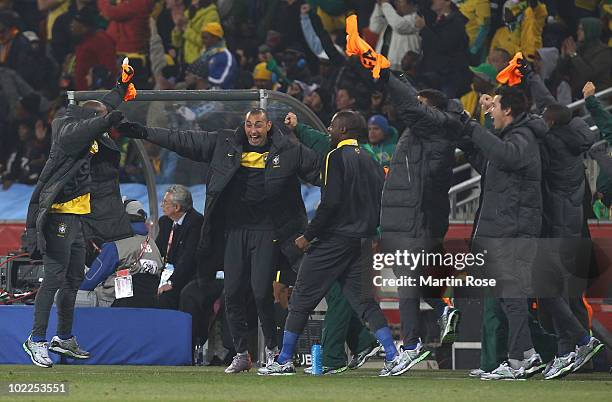 Gomes of Brazil celebrates with the Brazil bench as Luis Fabiano opens the scoring during the 2010 FIFA World Cup South Africa Group G match between...