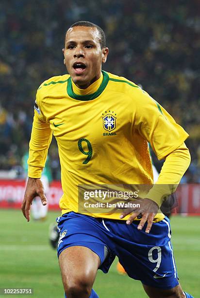 Luis Fabiano of Brazil celebrates scoring the opening goal during the 2010 FIFA World Cup South Africa Group G match between Brazil and Ivory Coast...