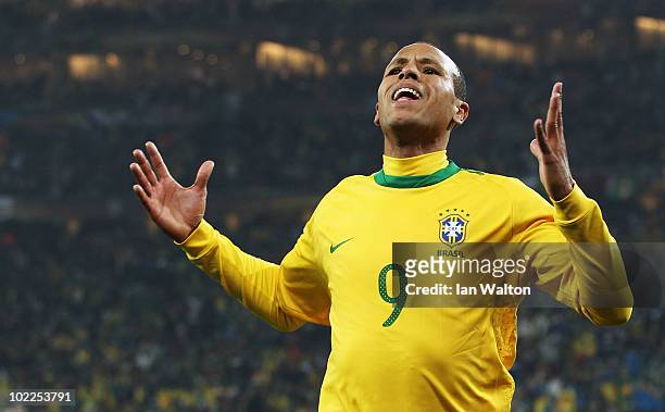 Luis Fabiano of Brazil celebrates scoring the opening goal during the 2010 FIFA World Cup South Africa Group G match between Brazil and Ivory Coast...