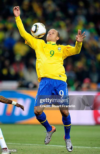 Luis Fabiano of Brazil controls the ball before scoring the second goal during the 2010 FIFA World Cup South Africa Group G match between Brazil and...