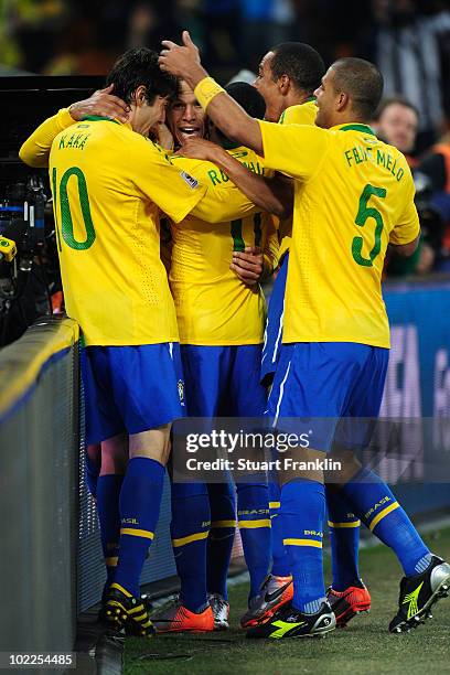 Luis Fabiano of Brazil celebrates scoring the second goal with team mates during the 2010 FIFA World Cup South Africa Group G match between Brazil...