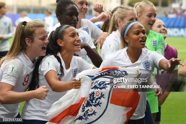 England's team players celebrate at the end of the Women's U20 World Cup 3rd place football match between France and England at the La Rabine...