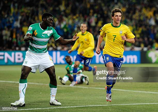 Elano of Brazil celebrates scoring his team's third goal during the 2010 FIFA World Cup South Africa Group G match between Brazil and Ivory Coast at...