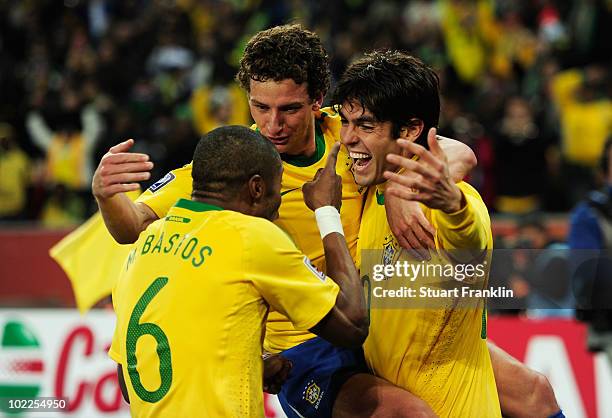 Elano of Brazil celebrates his goal with team mates Kaka and Michel Bastos during the 2010 FIFA World Cup South Africa Group G match between Brazil...