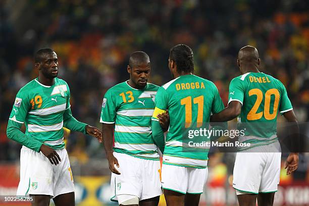 Yaya Toure, Romaric, Didier Drogba and Guy Demel of Ivory Coast line up in a wall during the 2010 FIFA World Cup South Africa Group G match between...