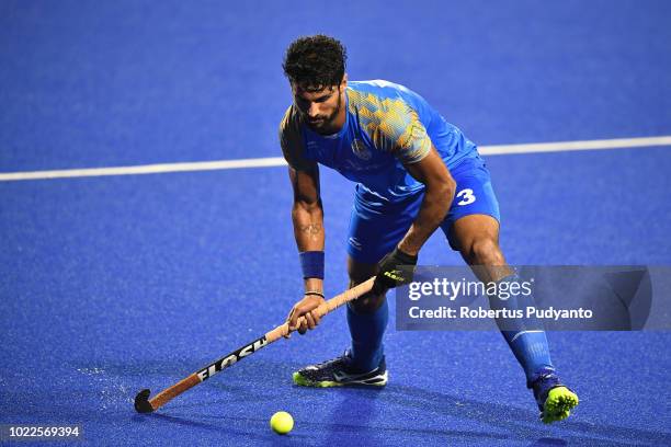 Singh Rupinder Pal of India in action during Men's Hockey Pool A Preliminary Round match between Japan and India on day six of the Asian Games on...