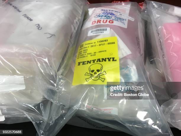 Bags of drugs are displayed on a table during a press conference held by the United States Attorney's Office at the John Joseph Moakley United States...