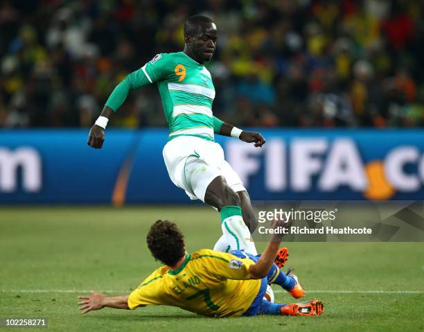 Ismael Tiote of Ivory Coast tackles Elano of Brazil which sees Elano stretchered off during the 2010 FIFA World Cup South Africa Group G match...