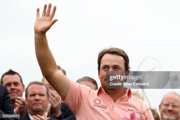 Graeme McDowell of Northern Ireland waves to the gallery on the 18th green after winning the 110th U.S. Open at Pebble Beach Golf Links on June 20,...
