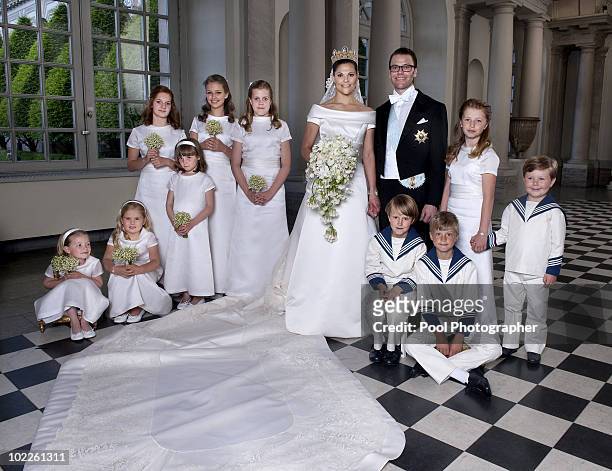 Crown Princess Victoria of Sweden and Prince Daniel, Duke of Vastergotland pose after their wedding with bridesmaids and page boys Vera Blom,...