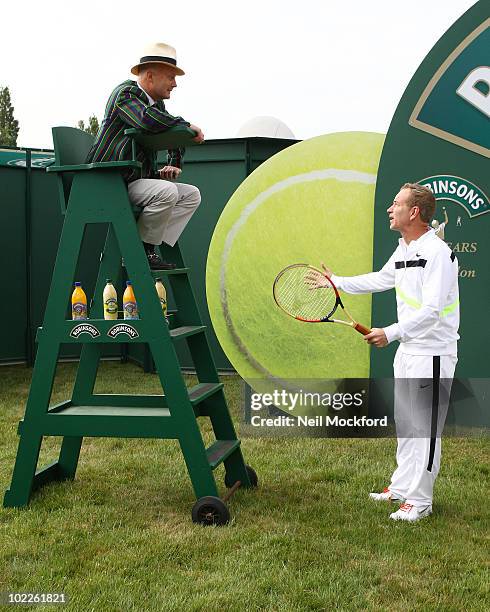 John McEnroe Tennis legend poses for photos to celebrate Robinson's 75th anniversary of their partnership with the Wimbledon Championships on June...