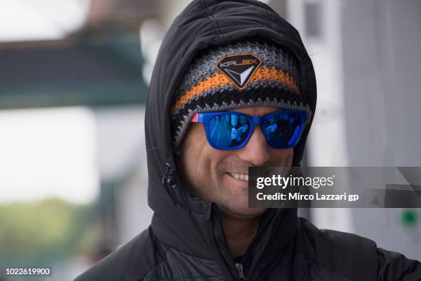 Mattia Pasini of Italy and Italtrans Racing smiles in pit during the MotoGp Of Great Britain - Free Practice at Silverstone Circuit on August 24,...