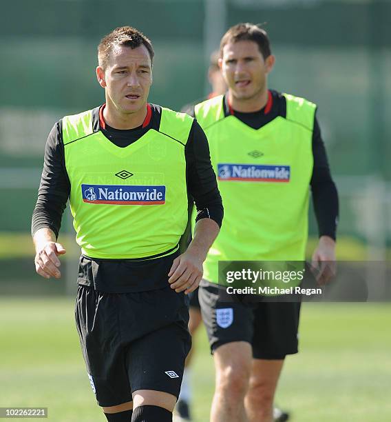 Frank Lampard and John Terry look on during the England training session at the Royal Bafokeng Sports Campus on June 21, 2010 in Rustenburg, South...