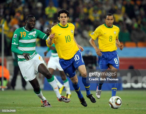 Kaka of Brazil with Yaya Toure of the Ivory Coast during the 2010 FIFA World Cup South Africa Group G match between Brazil and Ivory Coast at Soccer...