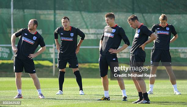 John Terry looks on as Wayne Rooney, Steven Gerrard; Jamie Carragher and Michael Dawson look on during the England training session at the Royal...