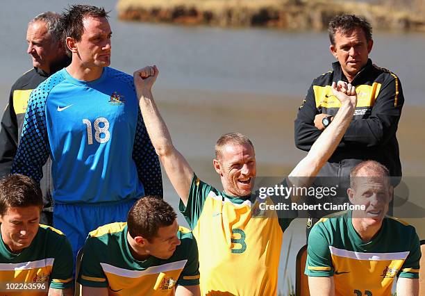 Craig Moore of Australia stretches as the Australia Socceroos pose for an official 2010 FIFA World Cup team photo at Kloofzicht Lodge on June 21,...