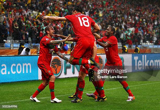 Raul Meireles of Portugal celebrates scoring the opening goal with team mates Tiago, Simao, Miguel and Hugo Almeida during the 2010 FIFA World Cup...