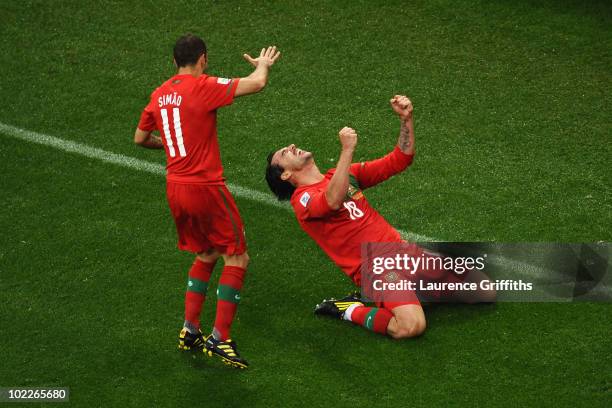 Hugo Almeida of Portugal celebrates scoring his side's third goal with team mate Simao during the 2010 FIFA World Cup South Africa Group G match...