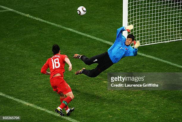 Hugo Almeida of Portugal scores his side's third goal past Ri Myong-Guk of North Korea during the 2010 FIFA World Cup South Africa Group G match...