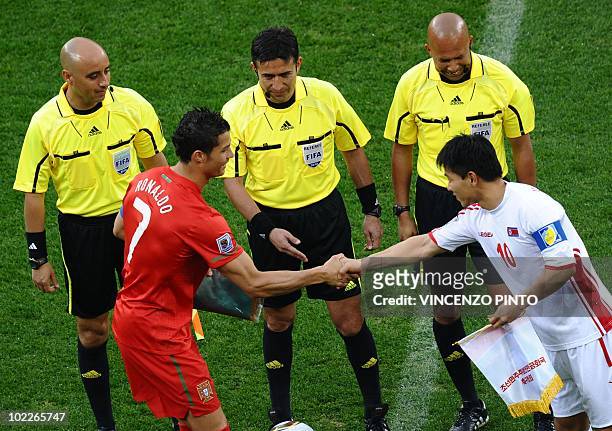 Team captains North Korea's striker Hong Yong-Jo shakes hands with Portugal's striker Cristiano Ronaldo before the Group G first round 2010 World Cup...