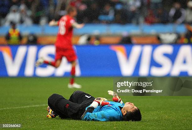 Ri Myong-Guk of North Korea lies on the pitch after conceding a goal during the 2010 FIFA World Cup South Africa Group G match between Portugal and...