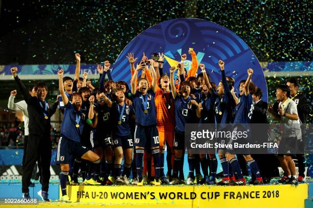 Fuka Nagano of Japan lifts the trophy as Japan celebrate victory following the FIFA U-20 Women's World Cup France 2018 Final match between Spain and...