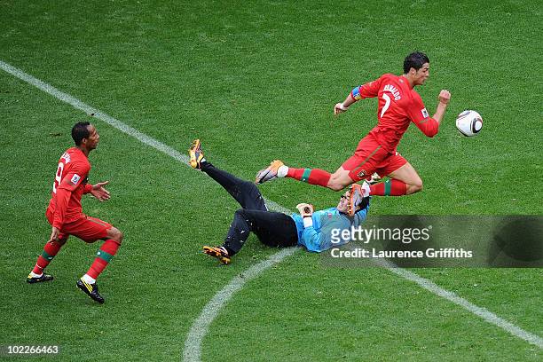 Cristiano Ronaldo of Portugal follows the ball as he scores his team's sixth goal past Ri Myong-Guk of North Korea during the 2010 FIFA World Cup...