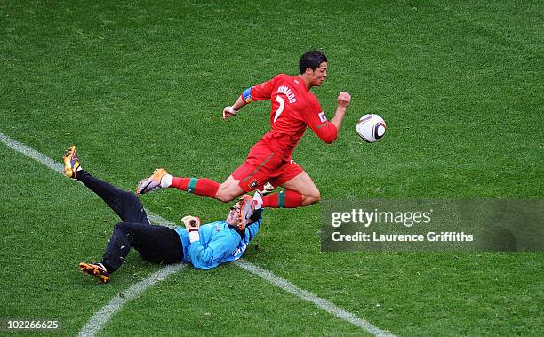 Cristiano Ronaldo of Portugal follows the ball as he scores his team's sixth goal past Ri Myong-Guk of North Korea during the 2010 FIFA World Cup...