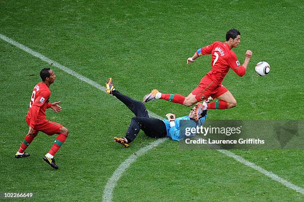 Cristiano Ronaldo of Portugal follows the ball as he scores his team's sixth goal past Ri Myong-Guk of North Korea during the 2010 FIFA World Cup...